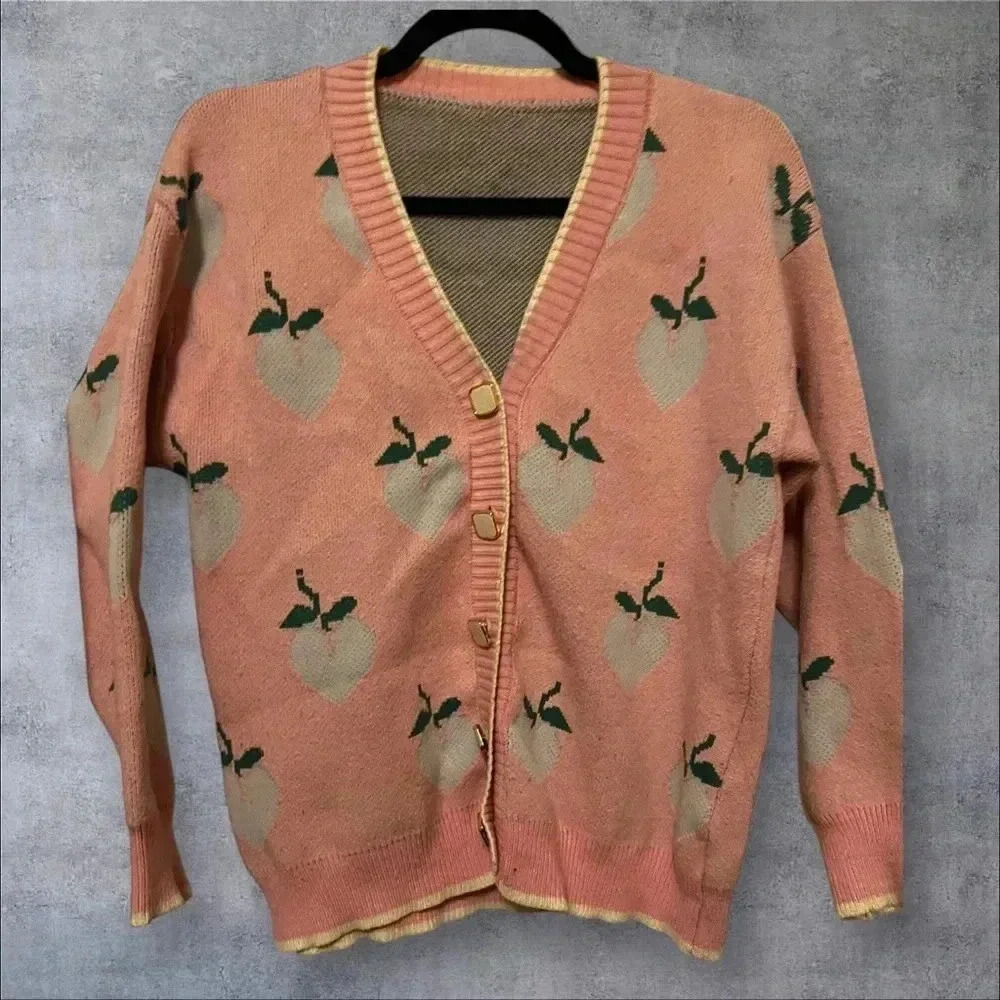 Peach sweater
Size medium